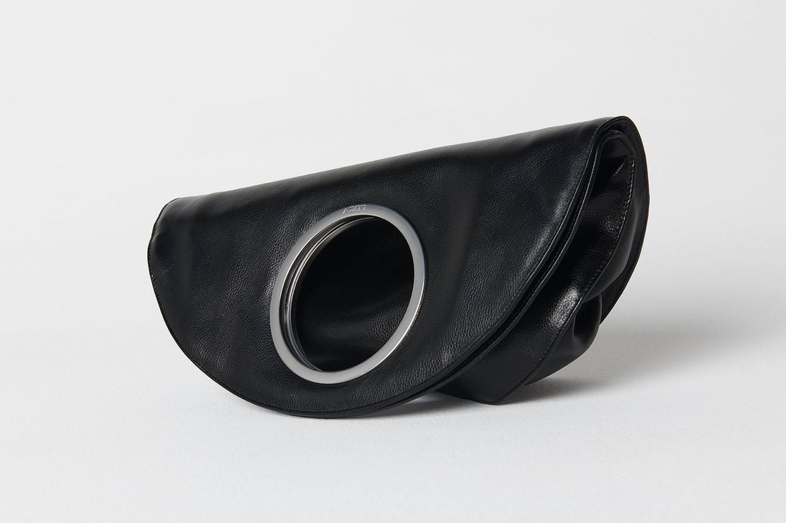 flat studio shot, white background, front face, bag upright